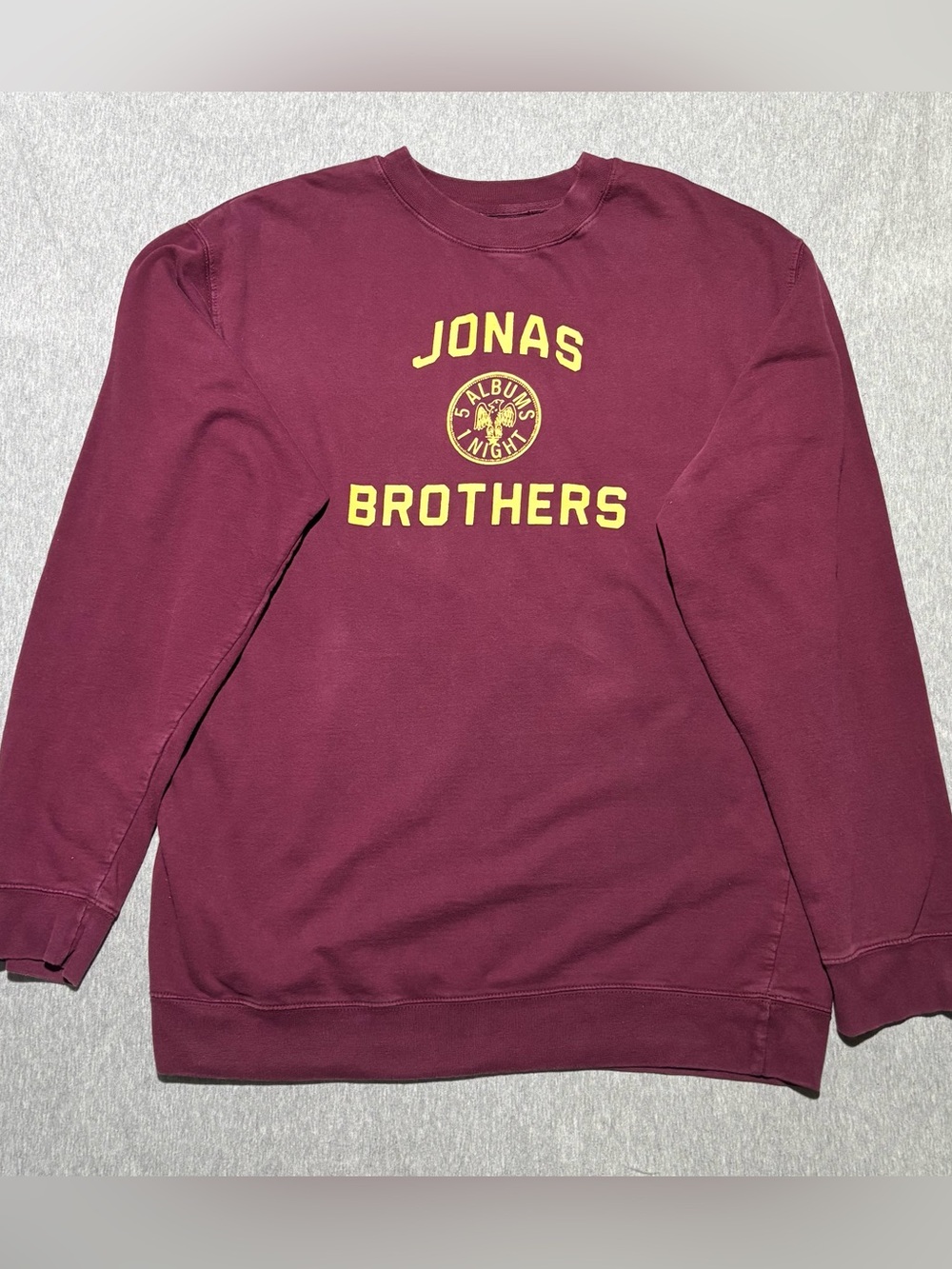 Jonas Brothers Maroon Graphic Crewneck Sweatshirt with Yellow Lettering